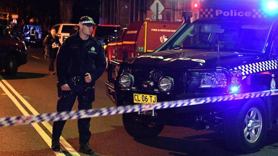 Police man a check point in the Sydney inner suburb of Surry Hills on July 29, 2017