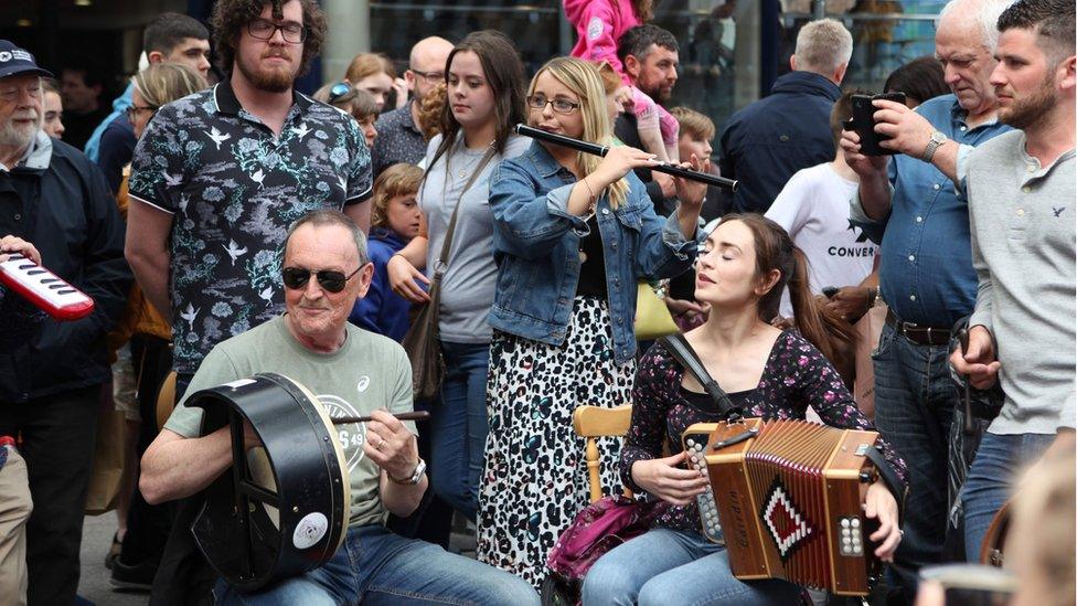 Two musicians playing in the street