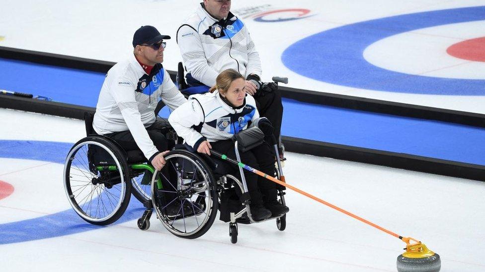 Scotland's Meggan Dawson Farrell pushes the stone in the semi-final match between Sweden and Scotland during the World Wheelchair Curling Championship, part of a Beijing 2022 Winter Olympic and Paralympic Games test event