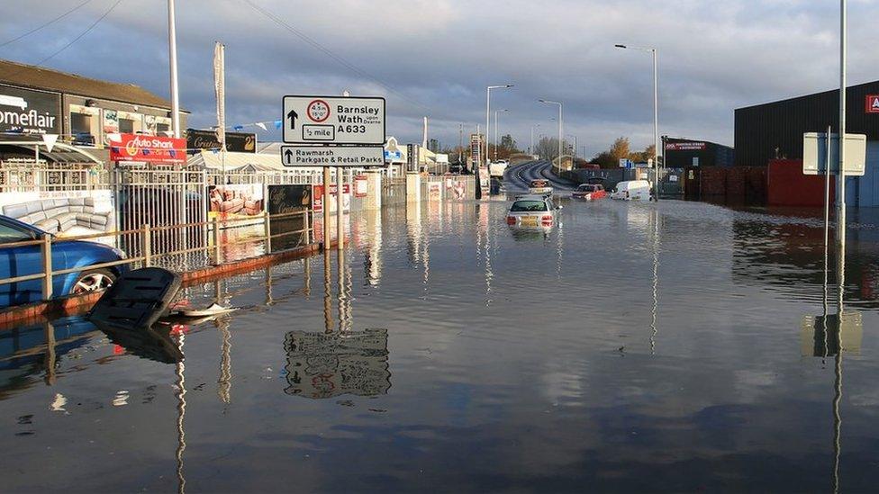 Vehicles submerged in floodwater in Rotherham