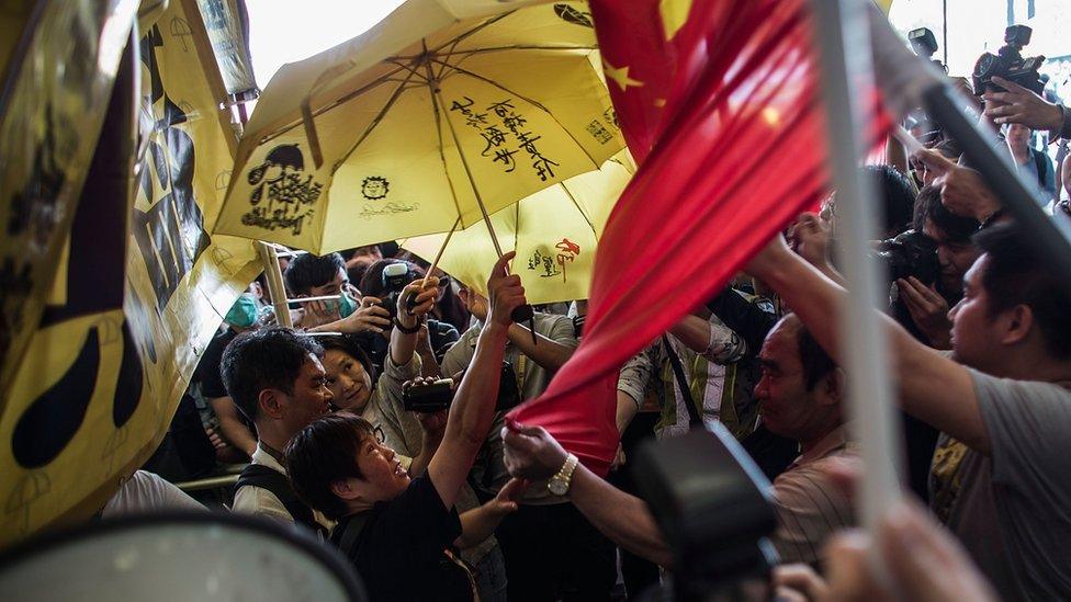 Pro-democracy protesters clash with pro-government supporters outside Legislative Council on April 22, 2015, Hong Kong