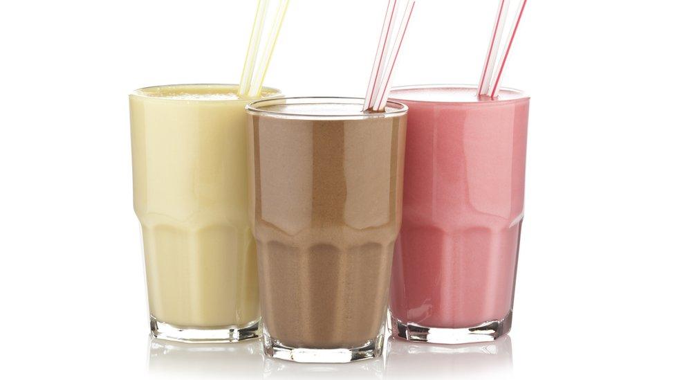 Glasses of different flavoured shakes