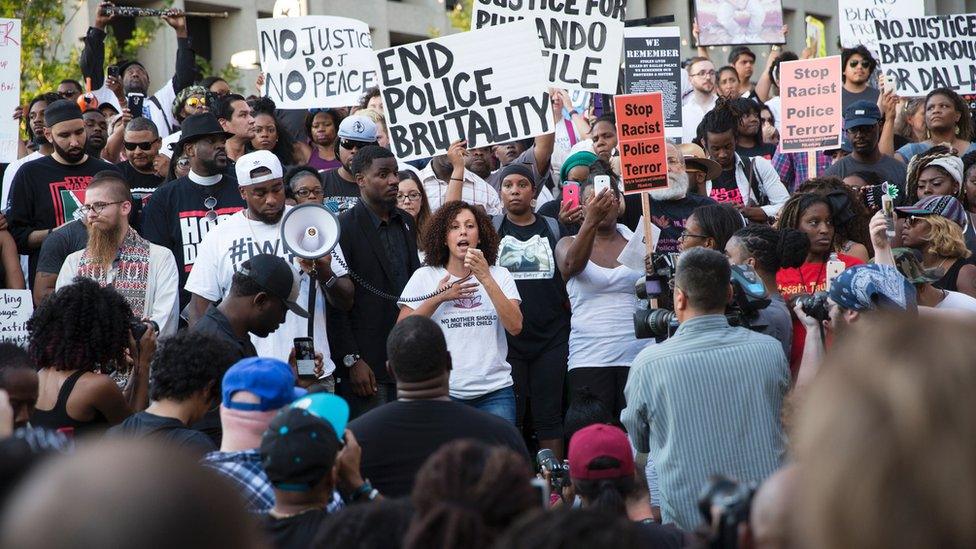 Protesters holding placards including 'End police brutality' - 7 July 2016