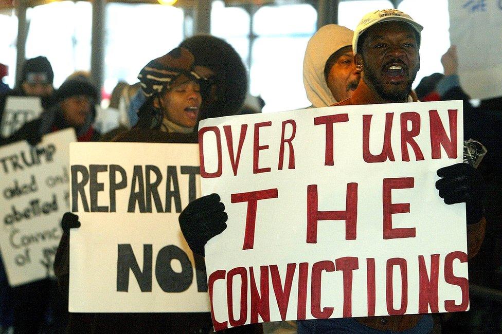 Protesters march in front of city court in New York