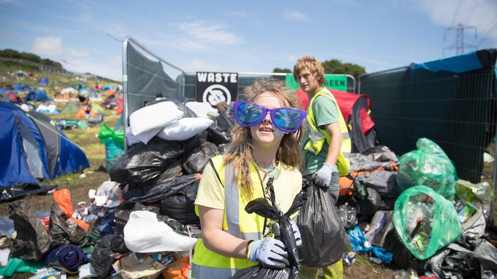 Collecting rubbish at Glastonbury