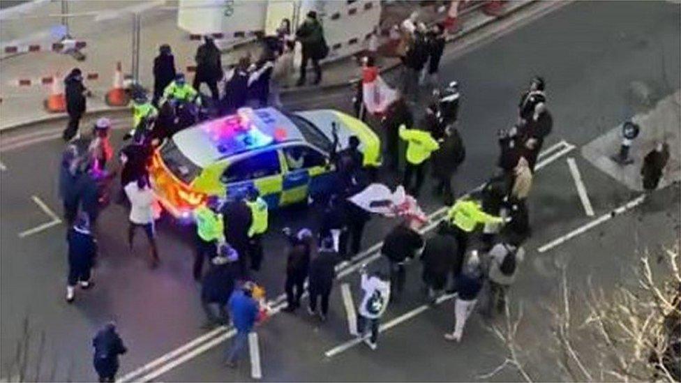 Police car surrounded