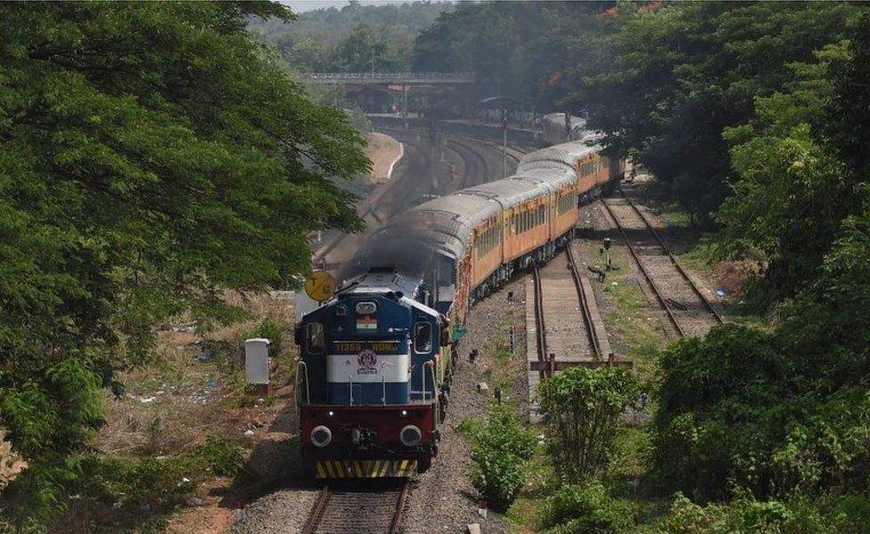 In this photograph taken on May 23, 2017, the Tejas Express luxury train leaves for its first return journey between Goa and Mumbai at the Karmali railway station in the Indian state of Goa.