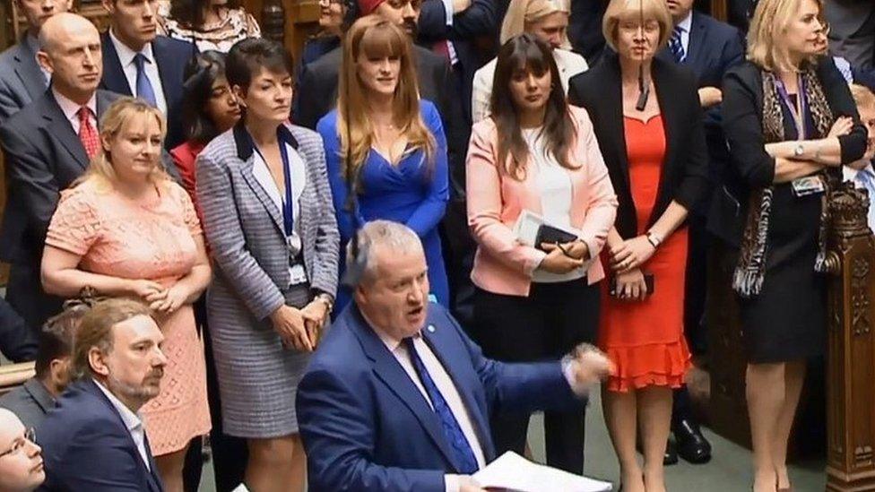 Tory MPs look on as the SNP's Ian Blackford speaks in Parliament