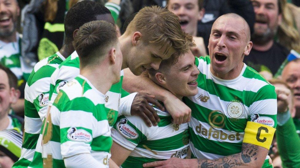 Celtic players celebrate against Rangers