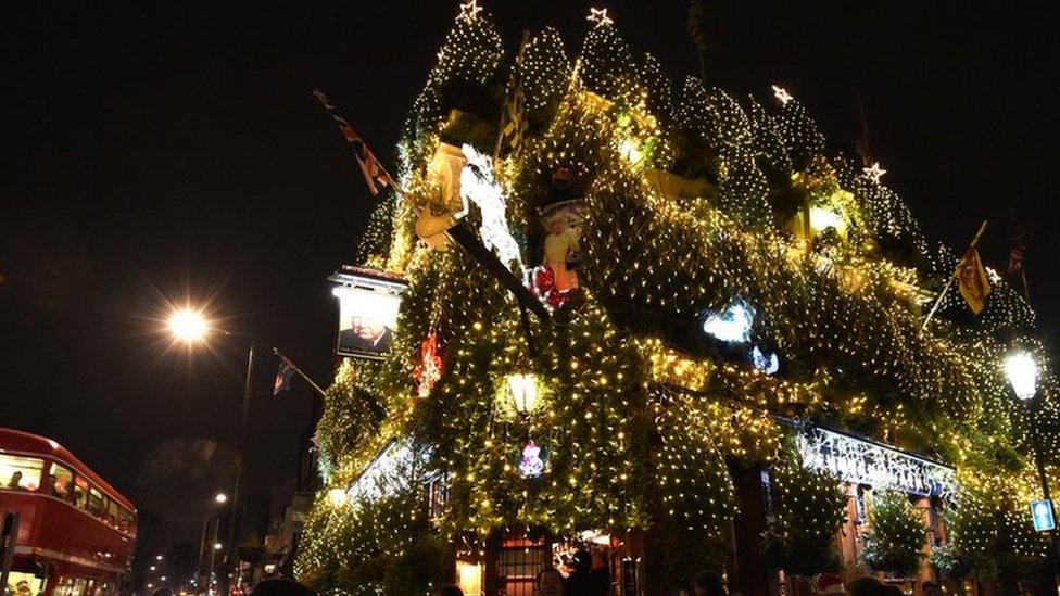 A general view of Christmas decorations outside The Churchill Arms pub