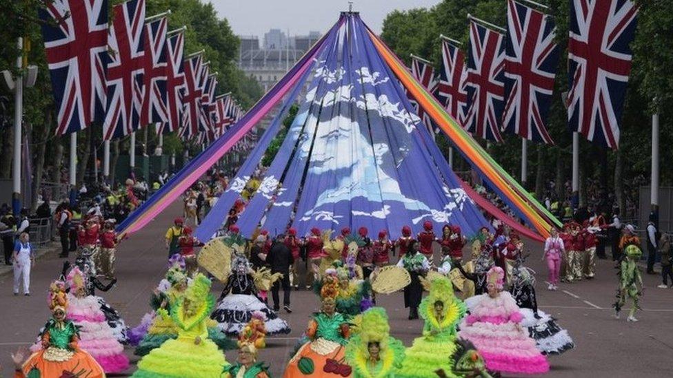 These dancers performed in front of ribbons which together show the Queen as a young woman.