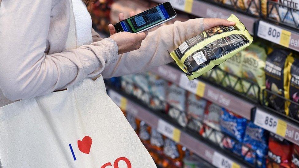 Shopper at experimental Tesco store