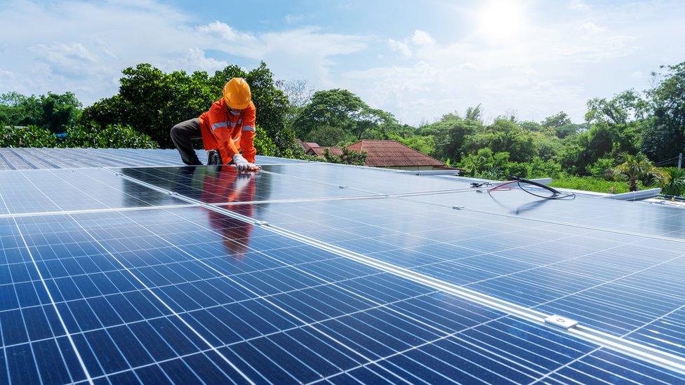 Technicians maintenance or install in solar power plant on the roof