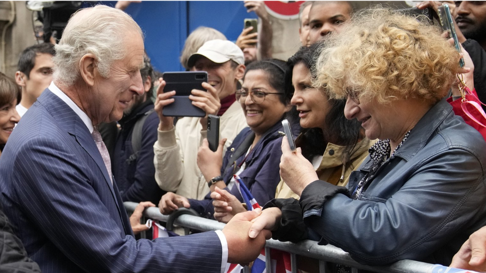 King Charles III meets residents after visiting the Flower Market in Paris during his three-day state visit to France