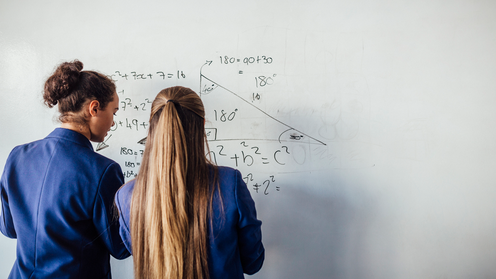 Teenagers solving maths problems