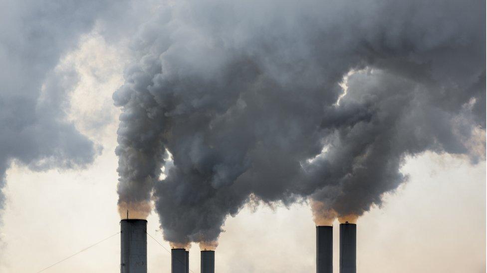 Smoke billowing out of a chimney