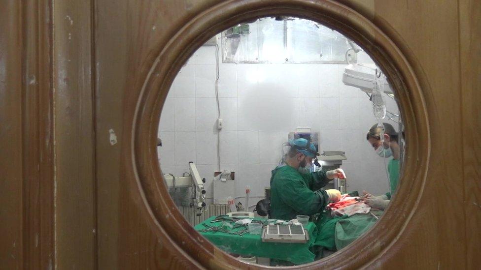 Surgery seen through window in door