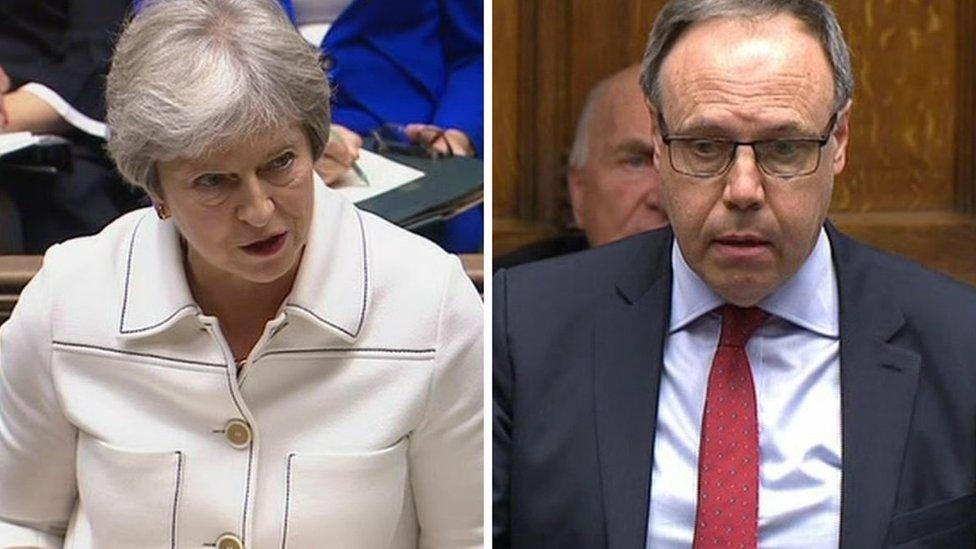 Theresa May and Nigel Dodds in the House of Commons