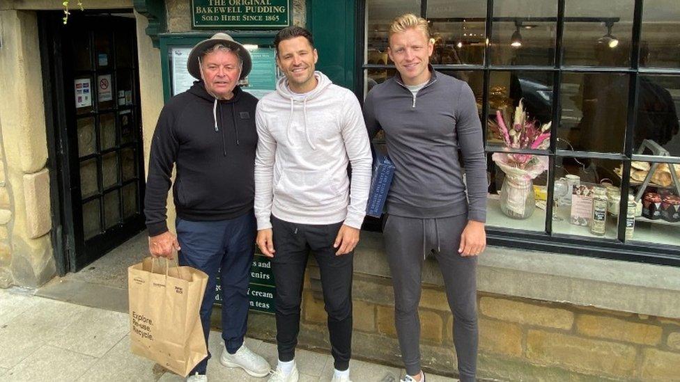 Three men at a pudding shop