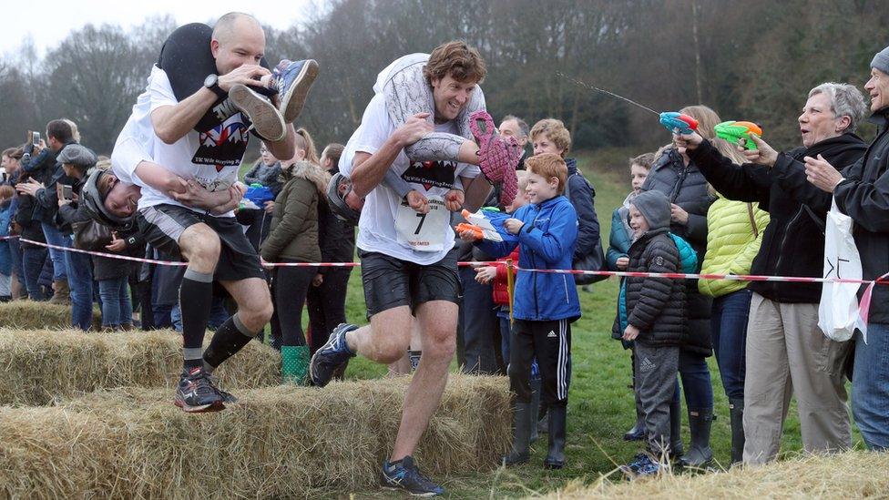 Competitors take part in the annual UK Wife Carrying Race