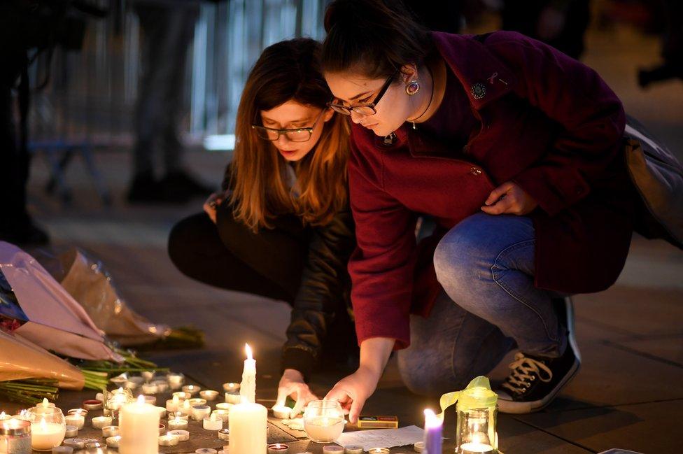 Members of the public attend a candlelit vigil in Albert Square, Manchester, 23 May