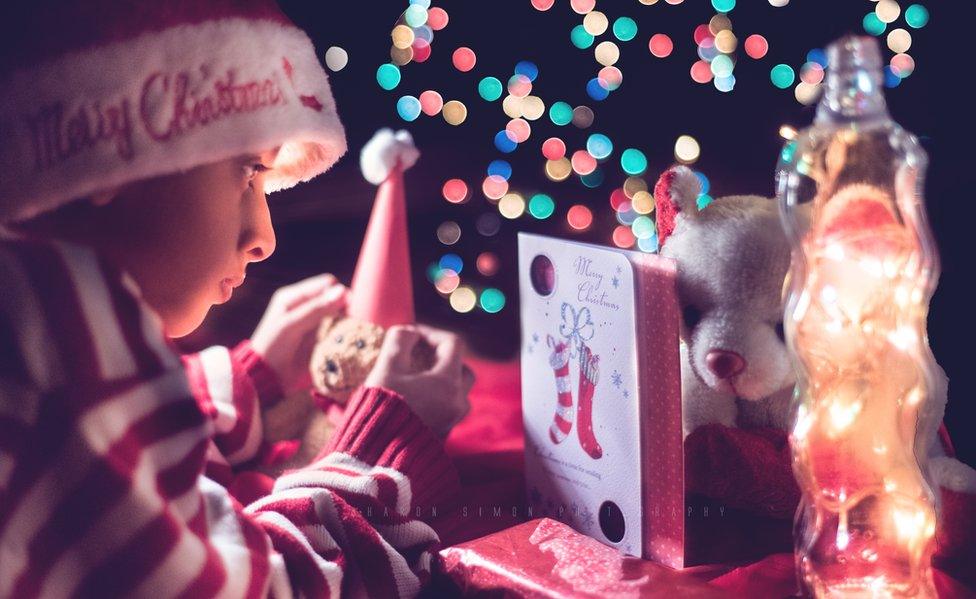 A child plays with their Christmas toy