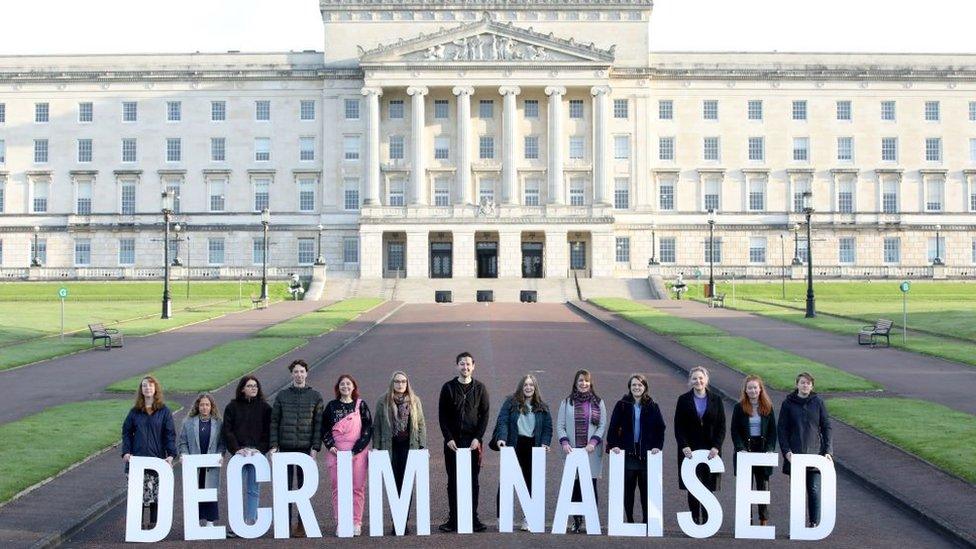 Pro-choice supporters pose as they gather at Parliament buildings on the Stormont Estate in Belfast on 21 October 2019