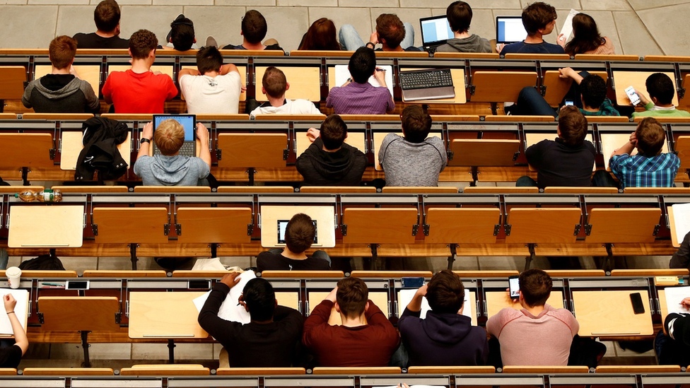 Students attending a lecture in an auditorium of a university