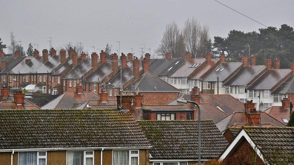 A grey sky above rooftops in Northampton