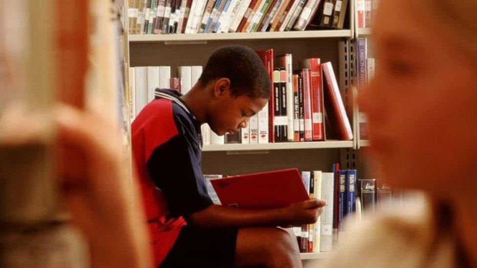 Children reading in a library