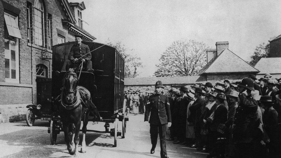 A Black Maria arrives at the court at Leicester Castle during the Green Bicycle Murder trial, 1920. Former soldier Ronald Light was accused of the murder of factory girl Bella Wright but found not guilty. The crime remains unsolved