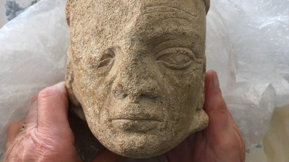 stone head of monk