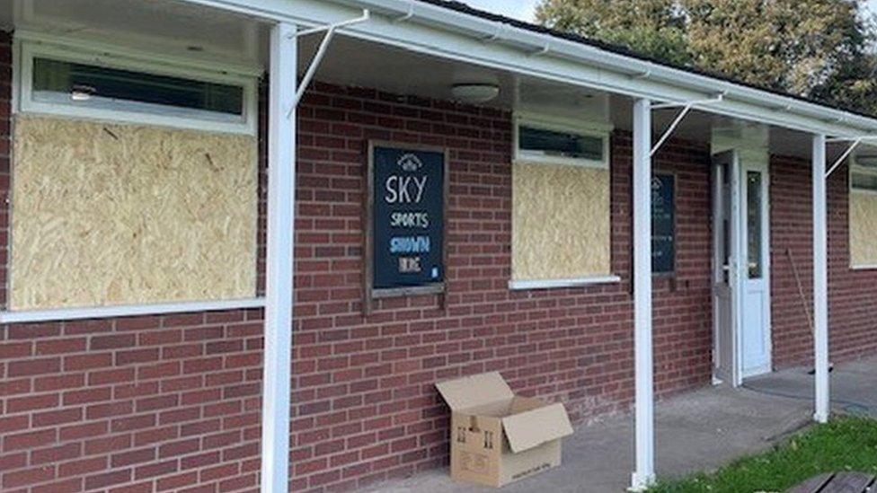 boarded-up windows at Whitchurch Cricket Club