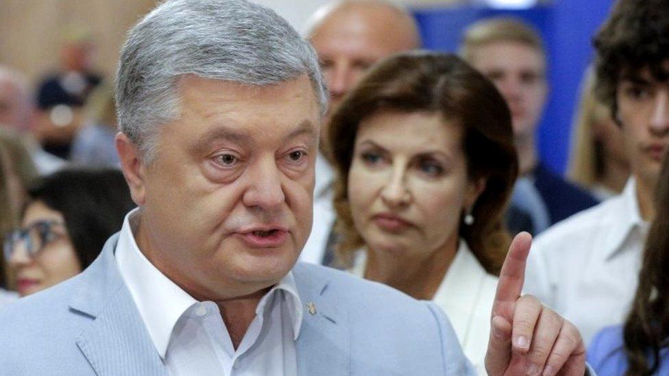 Former Ukrainian President Petro Poroshenko speaks to reporters at a polling station in Kiev. Photo: 21 July 2019