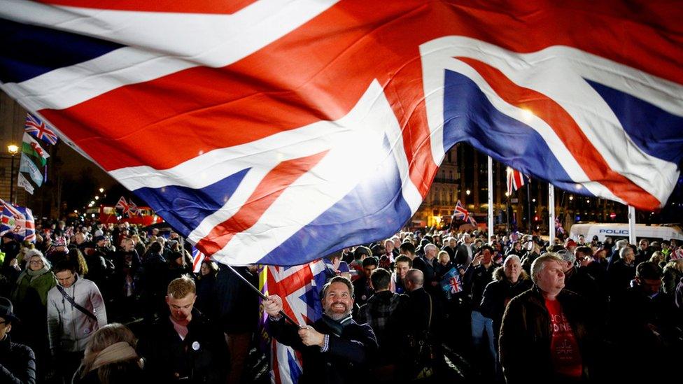 A man waves a UK flag on Brexit day in London, Britain, 31 January 2020.