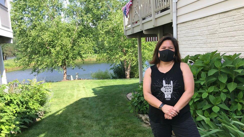 Cristina Pasa Gibson, shown at her parents' house in Gainesville, Virginia, standing outside