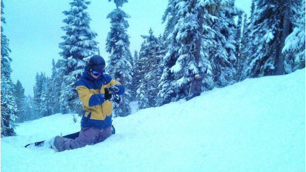 Owen Pick kneeling in the snow