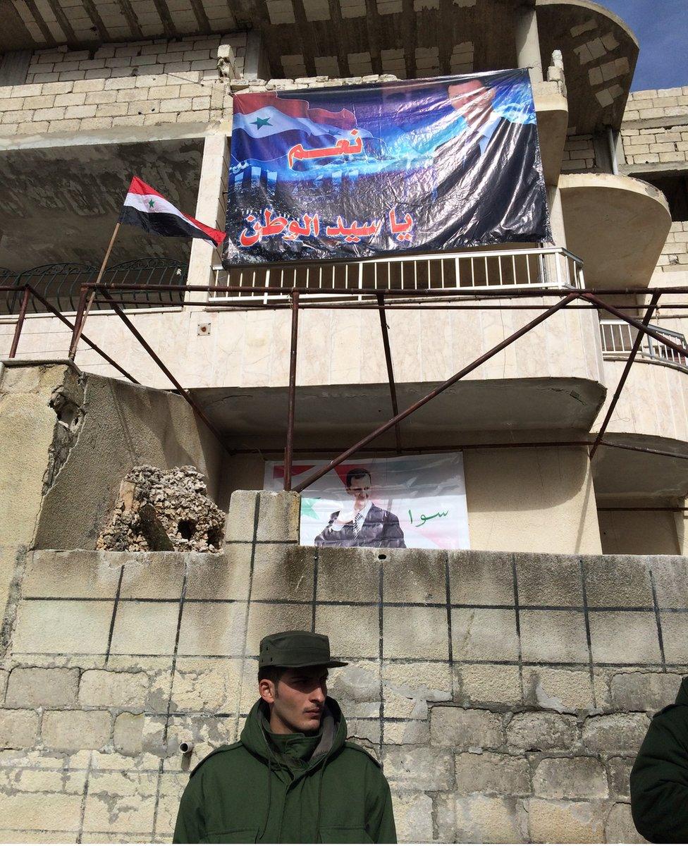 A man stands in front a building in Salma