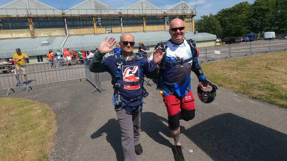 Mark Pile with his skydiving instructor