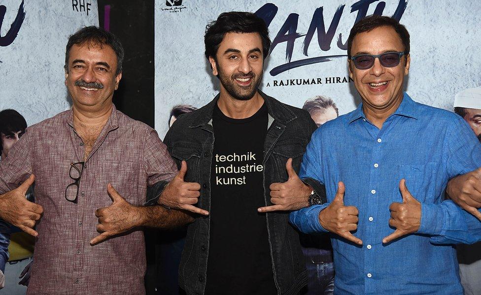 Actor Ranbir Kapoor (C) with director Rajkumar Hirani (L) producer Vidhu Vinod Chopra (R) in Mumbai for the film's promotion.