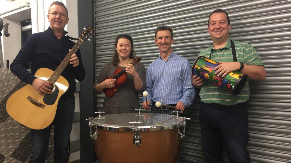 The four musicians are using their spare time to repair the instruments