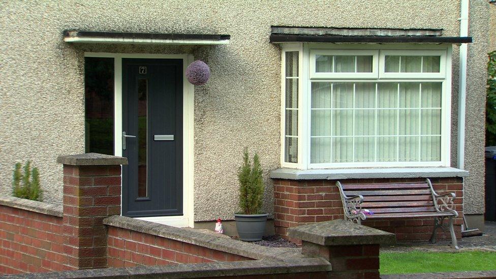 The woman was found dead in a house on Sunday