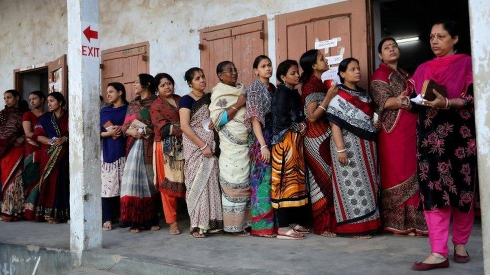 Voters wait to cast their ballots in Dhaka