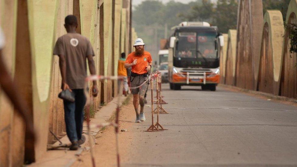 Russell Cook running in Africa