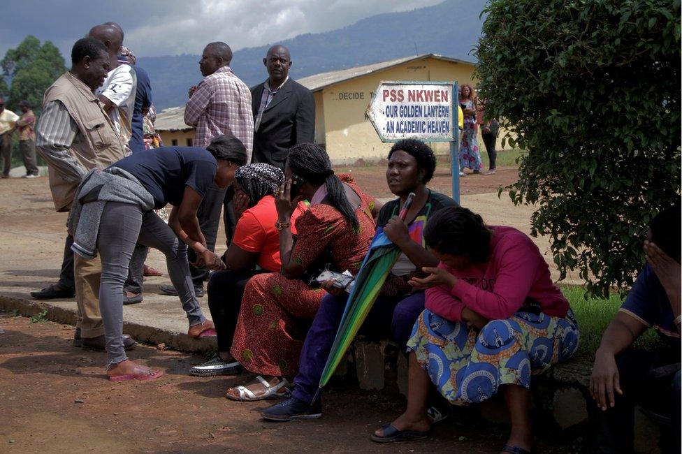 Parents await for news of their children at a school where 79 pupils were kidnapped in Bamenda, Cameroon November 6, 2018.