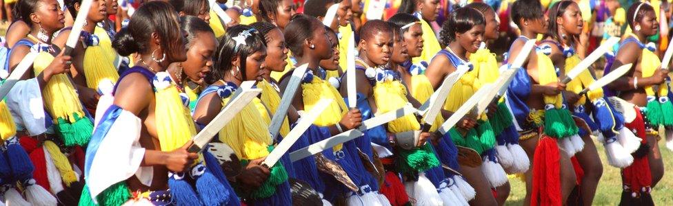 Unmarried women from Swaziland dance for Africa's last absolute monarch, King Mswati III (unseen) at the Ludzidzini Royal Residence near the capital Mbabane, August 2011