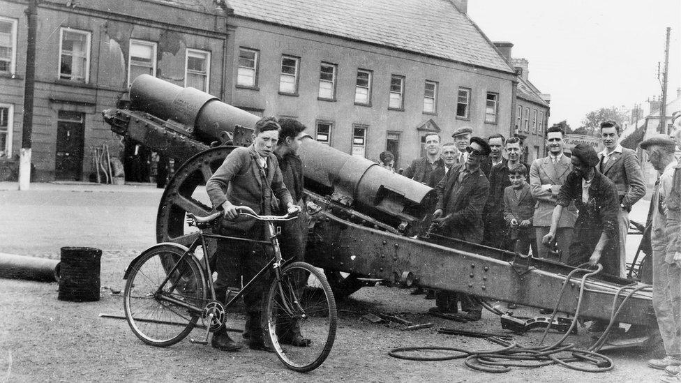 The captured German field gun being removed for scrap