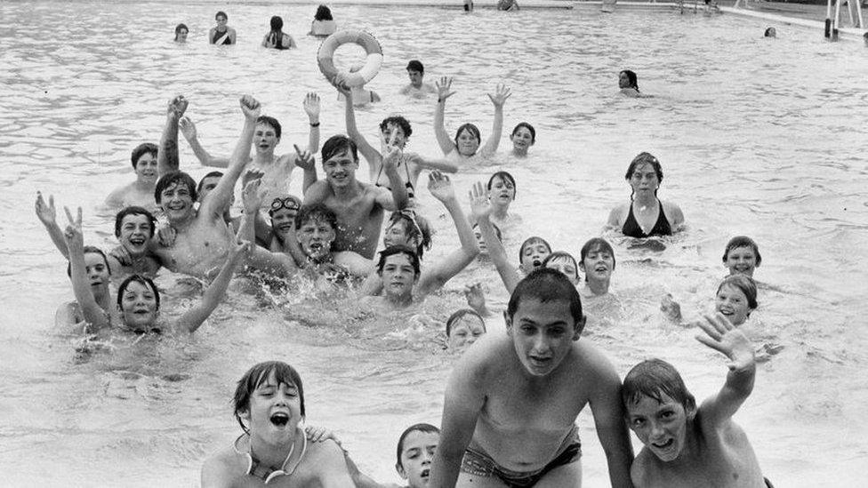 Children and families splashing about in Hull Albert Avenue's outdoor pool in August 1984