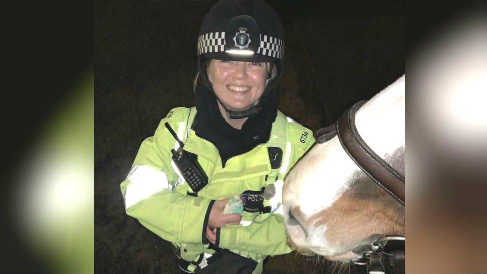 Police officer with horse and budgie