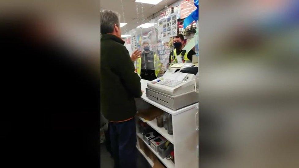 Footage of police officers at the shop